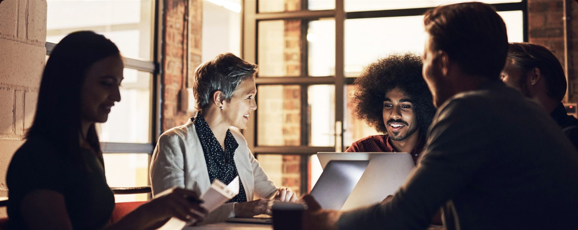 Insurance professionals collaborating in a modern office