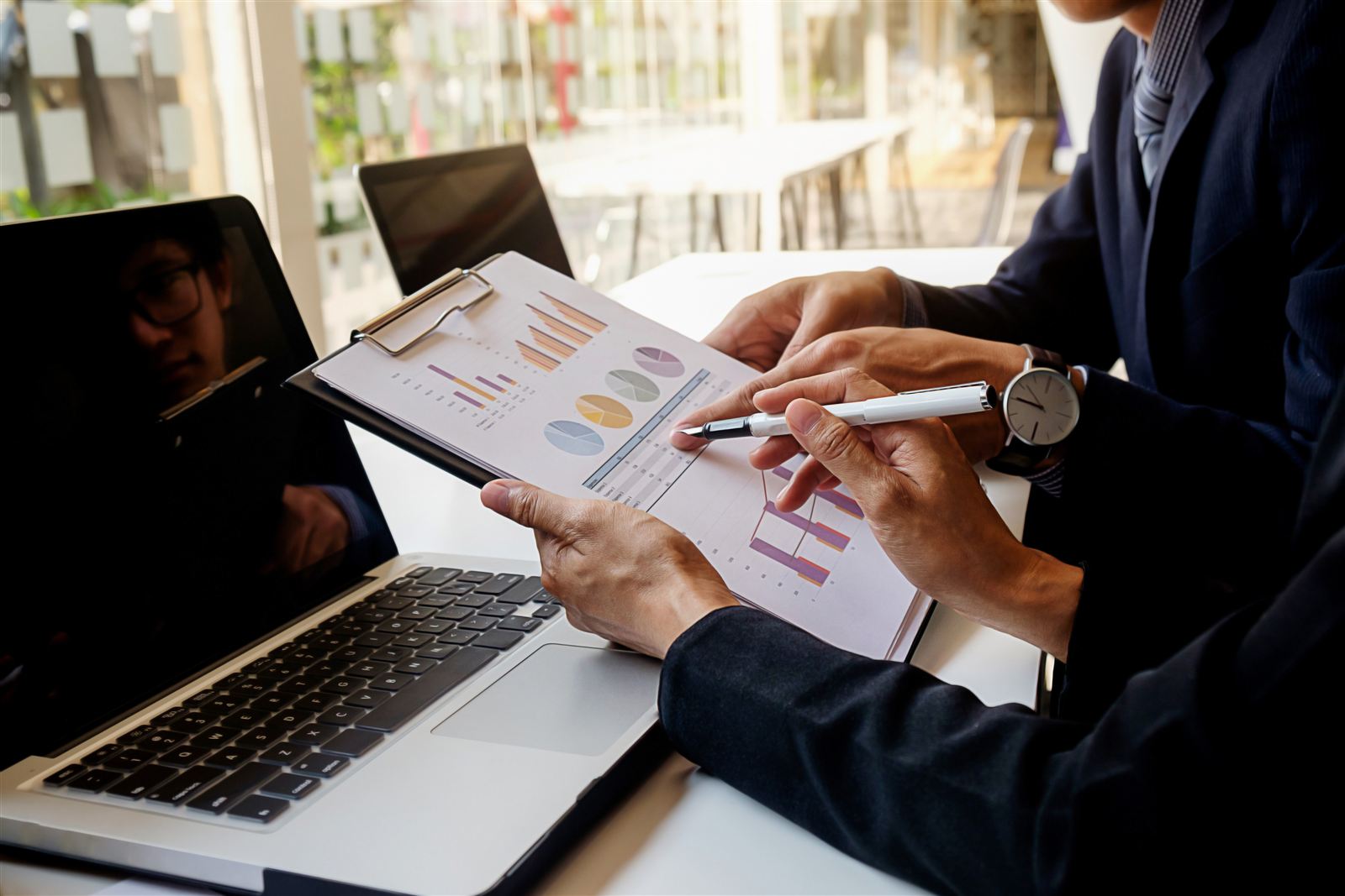 Analyst reviewing dashboards on a laptop