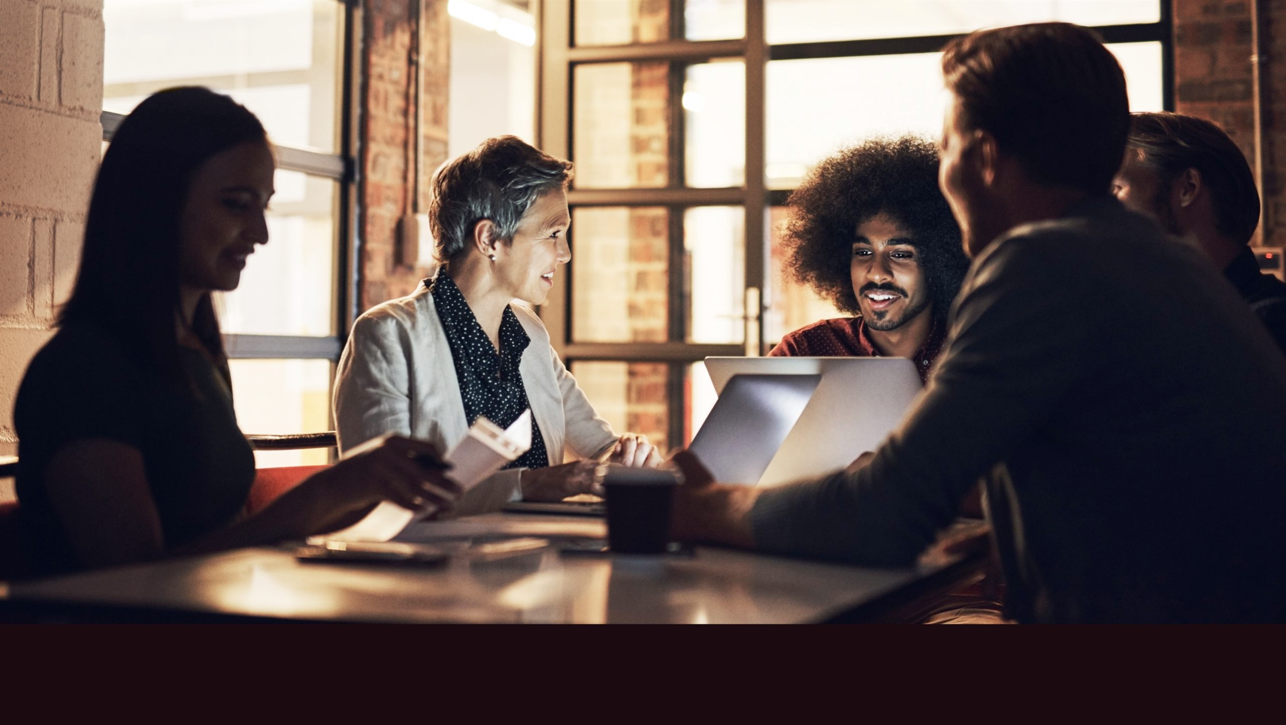 Insurance professionals collaborating around a meeting table